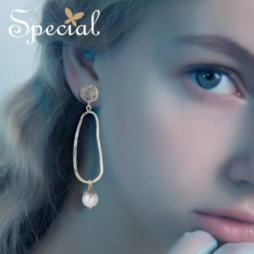 Special European and American fashion personality with thin skin pearl S925 silver needle long earrings female earrings earrings