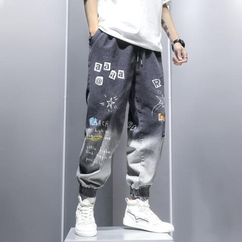 Summer trend cartoon graffiti letter printing jeans male harem pants loose elastic waist pants men boy trouser blue black color