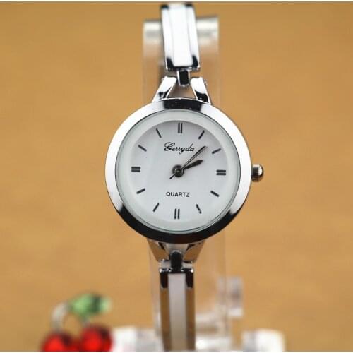 Free shipping!bracelet style chain lady watches,gold plating alloy case,simple design dial,metal chain belt,quartz movement