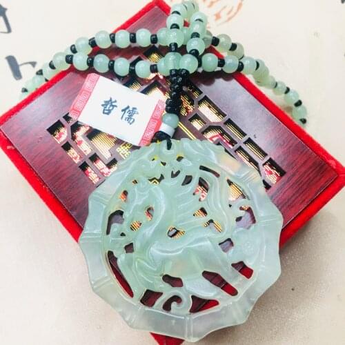 Zheru natural Hetian jade light green hollow horse pendant with Yuzhu necklace Men and women couple sweater chain