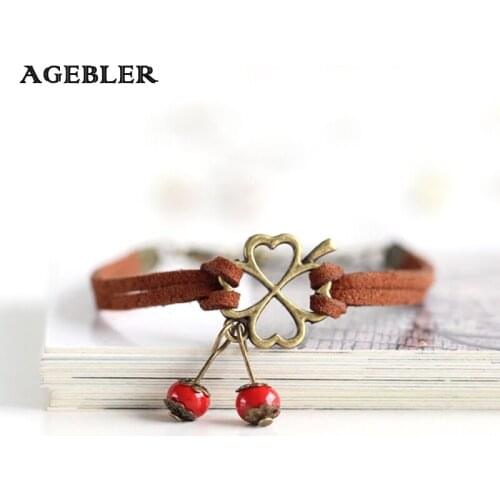 Fashion Bracelets For Women Handmade Ceramic bracelets & bangles Clover and Red Bead Pattern Pendant Leather Rope Jewelry Lucky