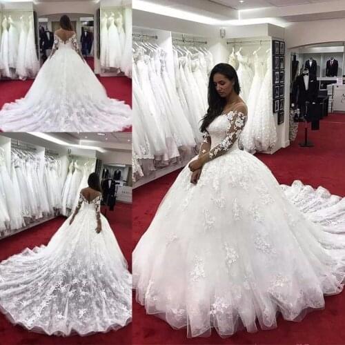 Modern Ball Gown Wedding Dresses Illusion Neck Long Sleeves Lace Applique Beaded Sheer Back Plus Size Bridal Gowns Mariee