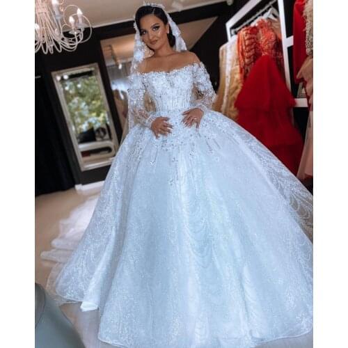 Plus Size Arabic Luxurious Sexy Lace Wedding Dresses Crystals Long Sleeves Bridal Dresses Sheer Neck Wedding Gowns