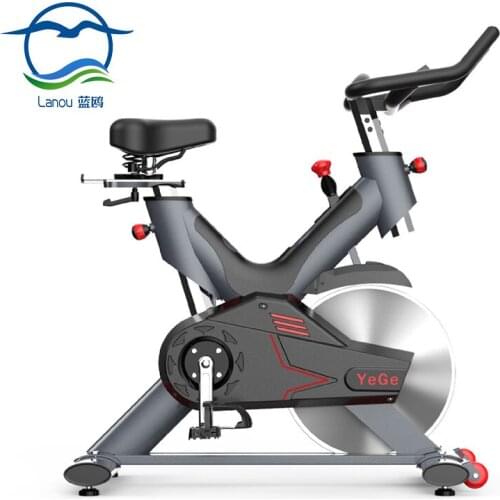 Commercial Large Flywheel Fitness Equipment Gray And Red Fiberglass Emergency Brake System Indoor Cycling Bikes