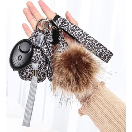 Wholesale Hand Sanitizer Keychain Set Wrist Pompom Defensa Personal Lipstick Set Key Chain Set Womens Security Alarm Key Ring