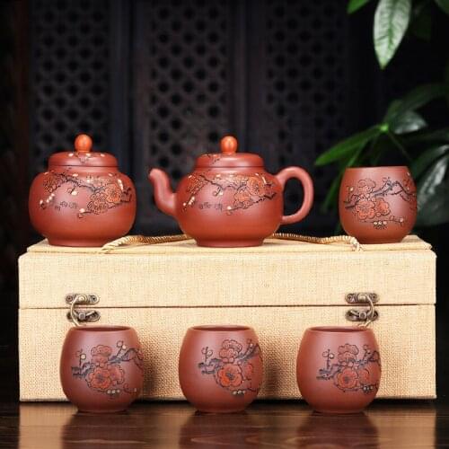 Yixing authentic ores are recommended by hand the plum blossom suit covered six times the teapot tea agent undertakes