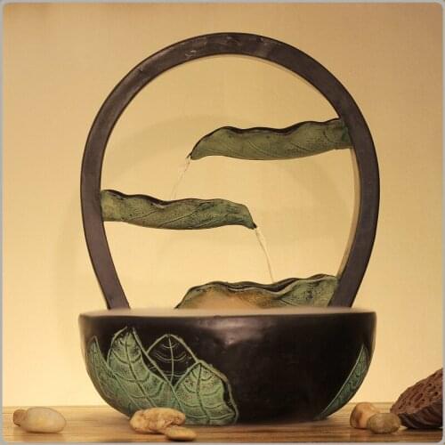 The new Chinese feng shui ornaments Home Furnishing Decor water living room setting desktop water fountain green leaves again an