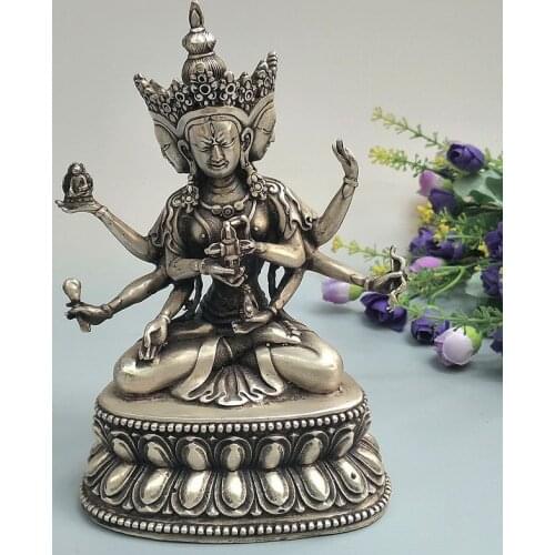 The Chinese Tibetan Silver Guanyin Buddha has a lotus, three-headed six-armed Guanyin