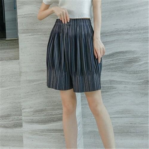 Miyake pleated shorts womens 2021 summer new fashion striped two-color pleated loose large size five-point pants womens trend