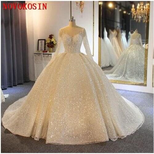 2020 Sample Sparkling Ball Gown Wedding Dresses Sheer Jewel Neck Appliqued Sequins Long Sleeves Lace Bridal Gowns Abiti Da Sposa