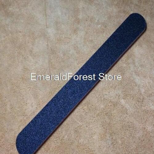 Skin sculpture with sanding strip, one side of coarse sand and one side of fine sand