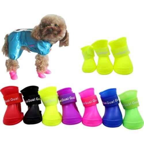 The pet dog boots with four silicone antiskid shoes wear waterproof dogs shoes candy colored pet rainy days appear essential