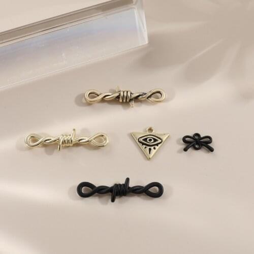 Autumn and winter retro black thorn bow eye geometric alloy pendant DIY handmade ear jewelry accessories materials