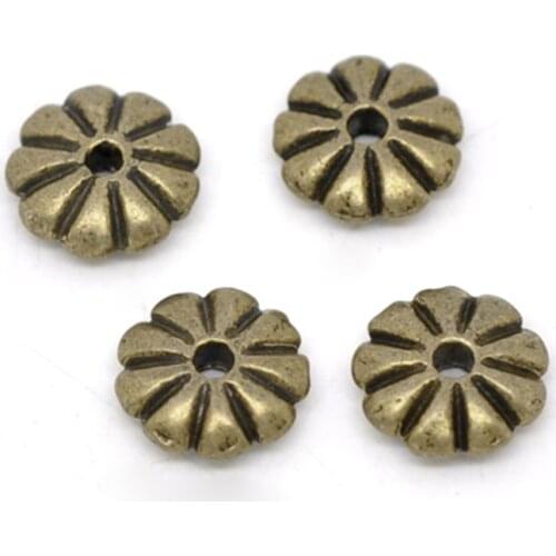 DoreenBeads 100 Bronze Tone Flower Spacer Beads Findings 7x2mm (B13677), yiwu