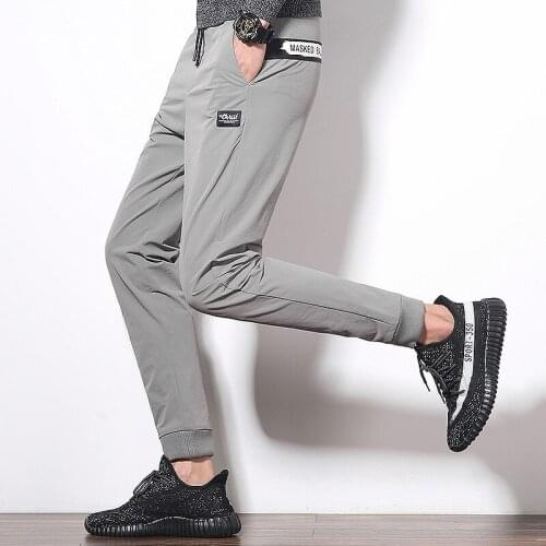 2020 hot sale Casual fashion mens Solid color elasticity slim trousers breathable windproof pencil pants Bind feet design