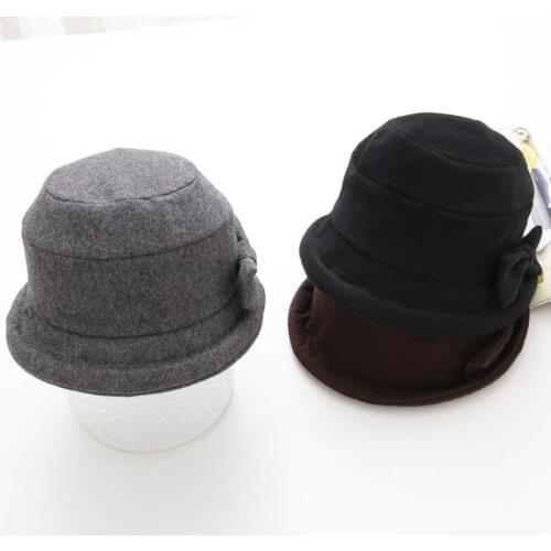 Free shipping High Quality Casual Woman Fedoras Wool Bucket Caps Classic Bow Elegance Warm Soft Short Brim Round Caps Bowler Hat