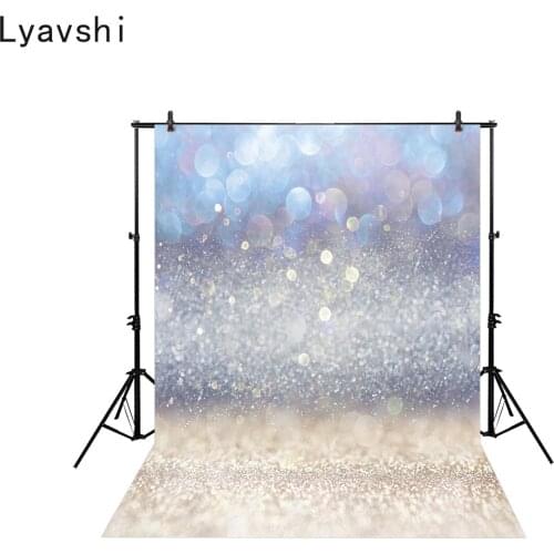 Lyavshi Glittering vintage lighting background with light burst silver blue and white photography background