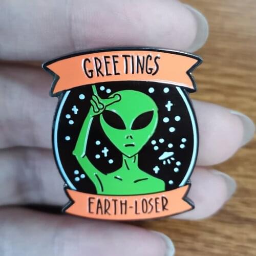 Alien Greeting Brooch An alien is waving, to offer a friendly greeting from outer space
