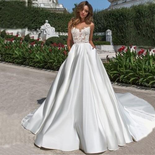 Simple A Line Satin Wedding Dreses Illusion Top 2020 Sheer Neck V Backless Bridal Gown With Pockets Lace Long Train Vestidos