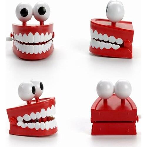 Cute Cartoon teeth Clockwork Toys Wind Up Light emitting teeth toys lovely ornaments Classic Toy For Children Gift Jump teeth