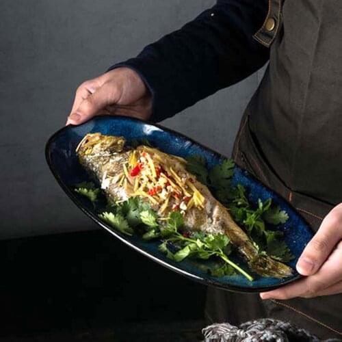 Japanese-style kiln becomes dark blue fish plate, household oval dish, cooking utensils, ceramic tableware, retro dinner plate