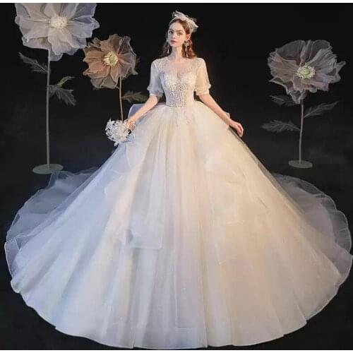 Wedding Dresses Illusion O-Neck Short Sequined Embroidery Pearls Tulle Lace Backless Luxury White Vintage Women Bridal Gown G358