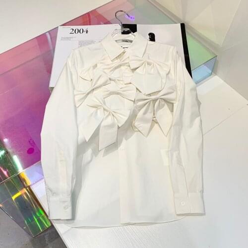2021 womens clothing early spring three-dimensional bow decoration shirt romantic simple shirt pattern stitching 1223