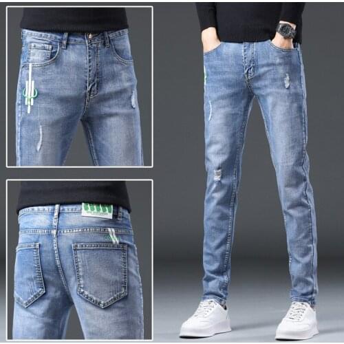 Casual business jeans mens self-cultivation stretch feet straight leg pants embroidery worn-out youth jeans autumn and winter
