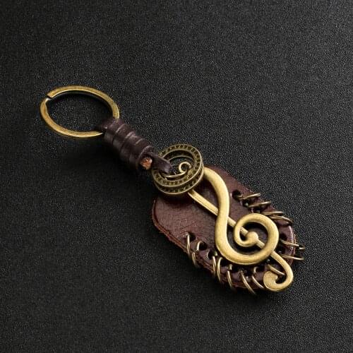 Angyape 2019 Fashion vintage brown Genuine Leather wing compass Music Symbol keychain handwork alloy Accessories men key chain