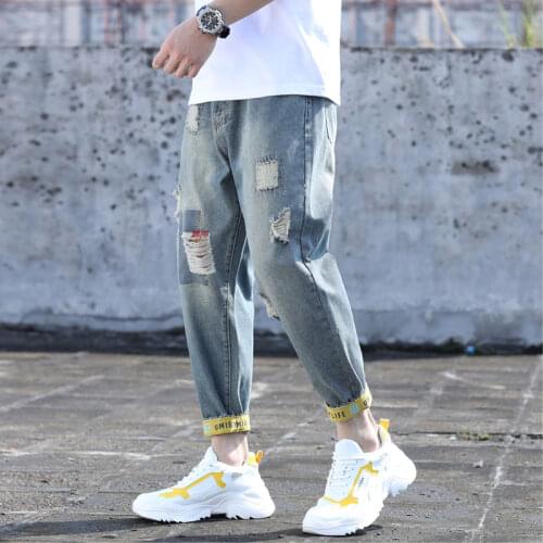 Spring mens nine-point pants tide brand plus fat plus size ripped feet casual pants fat pants loose jeans autumn