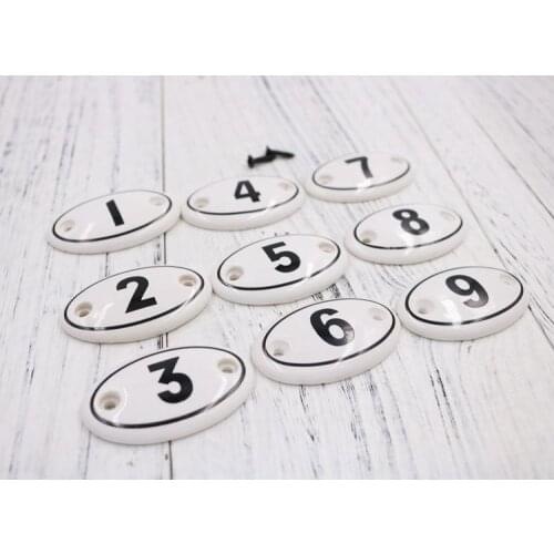Double-hole American multi-function ceramic multi-cabinet distinguishing hooks Arabic numerals handle wake up sign