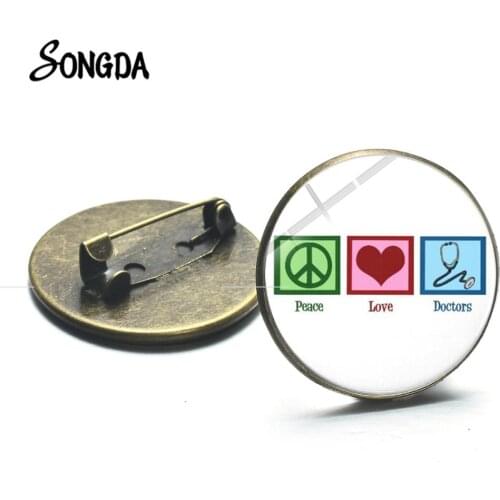 Peace Love Doctor Sign Brooches Nurse Is a Work of Heart Medical Tools Glass Cabochon Hospital Coat Metal Pins Decoration