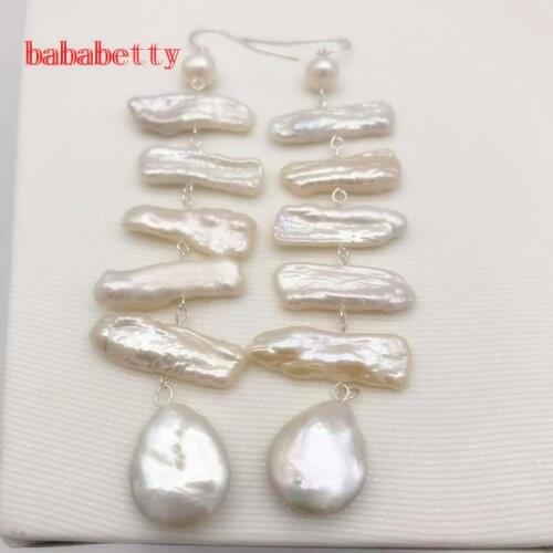 Natural freshwater white pearl lute irregular pearl twisted buckle pearl earrings Tibetan silver 9 cm long