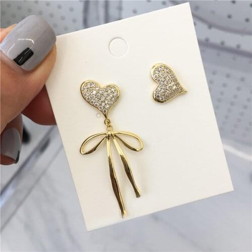 Fashionable peach heart earrings design asymmetric heart-shaped bow stud earrings