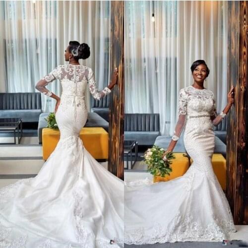 African Plus Size Mermaid Wedding Dresses Long Sleeves Lace Appliqued Crystal Beaded Sweep Train Wedding Gowns Robe De Mariee