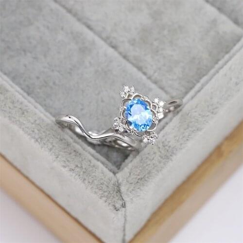 Best selling European and American S925 silver fashion wedding ring snowflake crown zircon light blue crystal luxury jewelry
