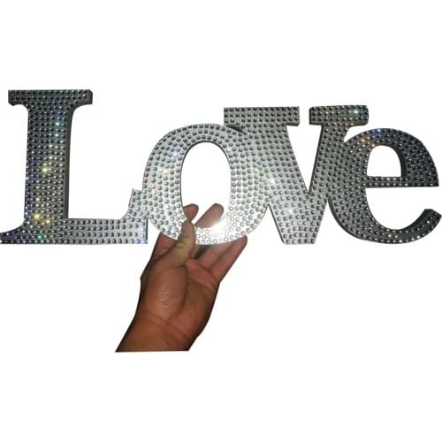 "LOVE" rhinestone decoration with gorgeous silver crystals intertwined