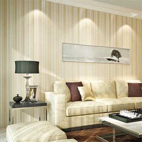 Beibehang Modern minimalist beige vertical striped non-woven living room TV background wallpaper bedroom sprinkled gold Nordic