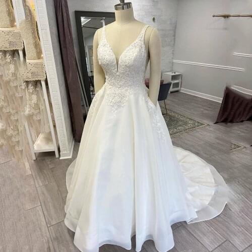 UZN Elegant White A-Line Beading Lace Appliques Wedding Dress V-Neck Straps Bridal Gown With Pockets Buttons Open Back Wedding