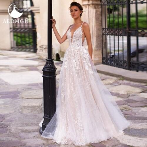 Aedmgh A-Line Beach Wedding Dresses 2021 V- Neck Spaghetti Straps Vestido De Novia Charming Lace Appliques Backless Bridal Gowns