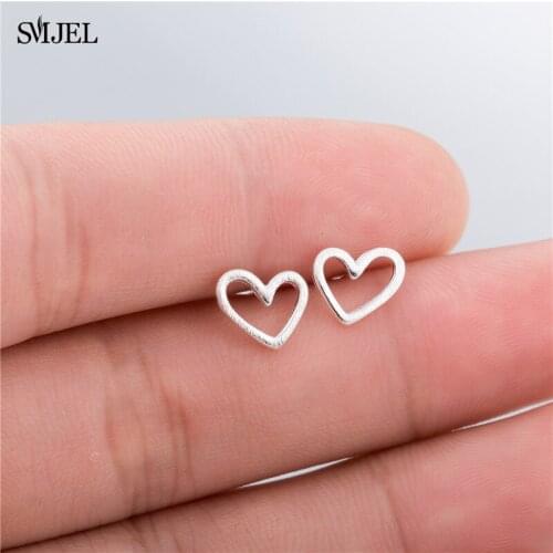 SMJEL MIni Love Heart Womens Earrings Everyday Jewelry Hollow Heart Earrings for Women Fashion Ear Jewelry Pendient brincos