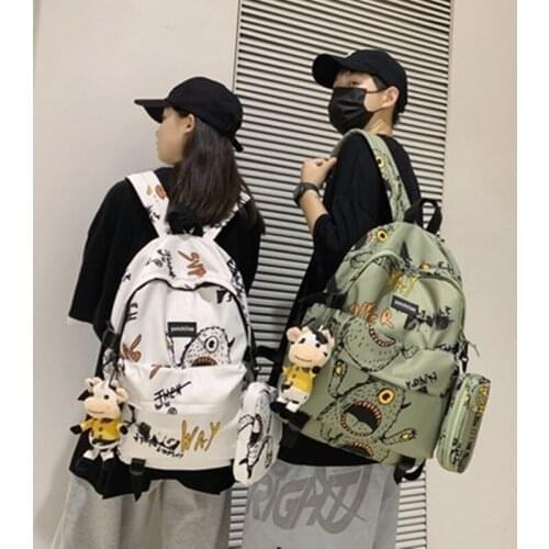 Graffiti big eye hanging small bag couple student backpack 2021 summer large-capacity casual men and women travel backpack