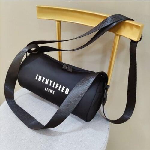 New womens cylinder bag elastic cloth bag English printed messenger bag personality double shoulder bag small bag tide