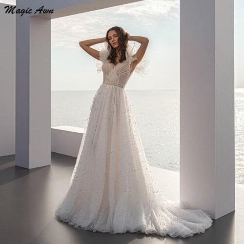 Magic Awn Graceful Tulle Wedding Dresses Beach Pearls Beaded Open Back Boho Bridal Gowns Sweep Train Abito Da Sposa 2021