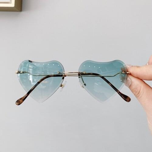 2019 Rimless Heart Shape Kids Sunglasses For Children Resin Lens Luxury Fashion Brand Baby Beach Travel Gift Metal Leg n443
