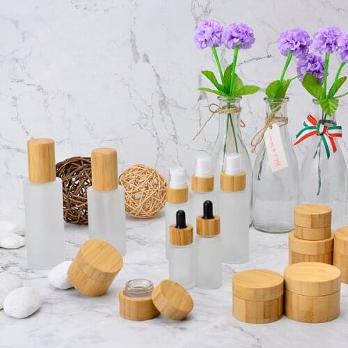 Eco friendly frosted glass lotion sprayer bottle with bamboo pump spray 30ml 50ml 100ml 4oz 150ml,bamboo cosmetic cbd dispenser