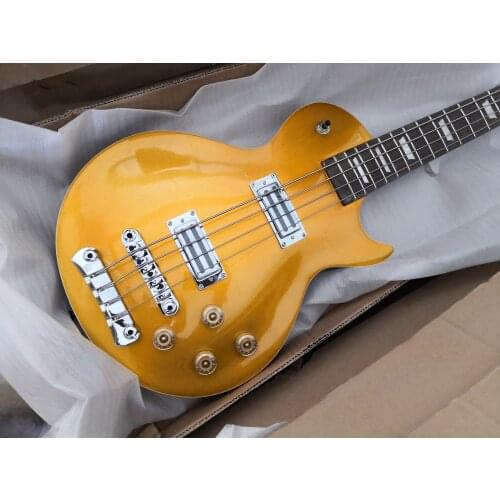 Custom 4 string golden bass guitar, carving,Sculpture body,opened pickups, pearl inlay,chrome bridge,neck set in body