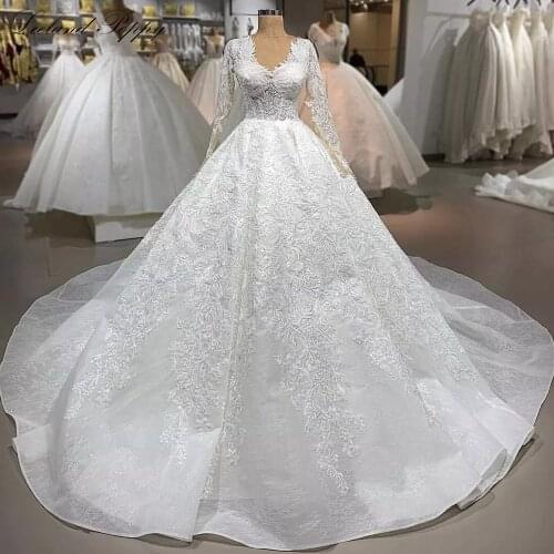 Lceland Poppy A-Line V Neck Lace Wedding Dresses 2020 Full Sleeves Pearls Beaded Floor Length Vestido de Novia Bridal Gowns