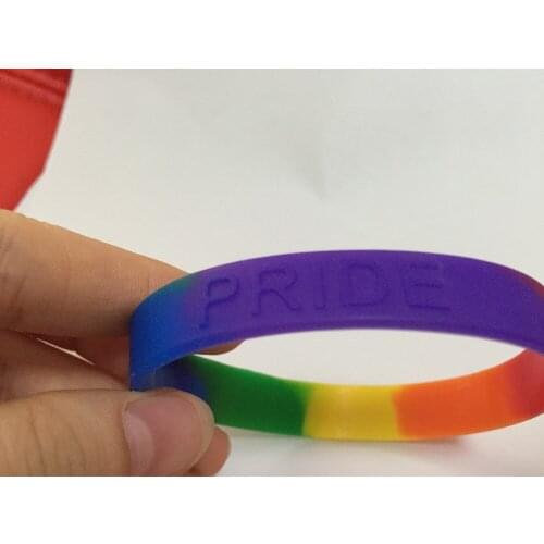 Six-color rainbow silicone bracelet Gay Pride Rainbow Colour Bracelet . Free shiping .202*12*2MM Embossed Free Shipping