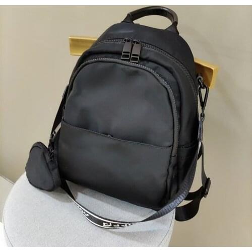 Casual backpack womens light Nylon Backpack with one shoulder compartment and small bag pendant commuting bag